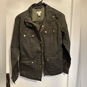J Crew olive green barn jacket size XS.  Zips and buttons with pockets.